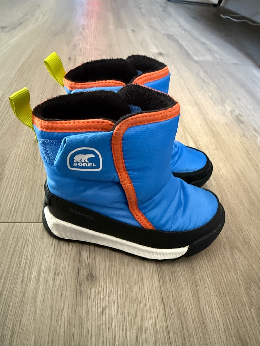 Sorel Kids Bright Blue Winter Boots with Orange Trim and Yellow Pull Tabs